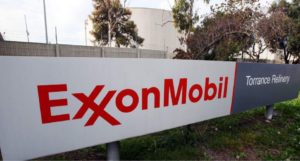 FILE - This Jan. 30, 2012, file photo, shows the sign for the Exxon Mobil Torrance Refinery in Torrance, Calif. Exxon Mobile Corp. reports financial results Friday, July 29, 2016. (AP Photo/Reed Saxon, File)