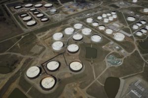 Crude oil storage tanks are seen from above at the Cushing oil hub, in Cushing, Oklahoma, in this March 24, 2016 file photo. REUTERS/Nick Oxford